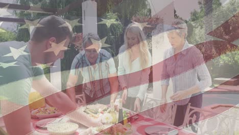animation of american flag over happy caucasian family having dinner outside