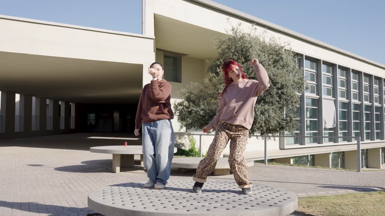 Young dancers performing energetic routine outdoors