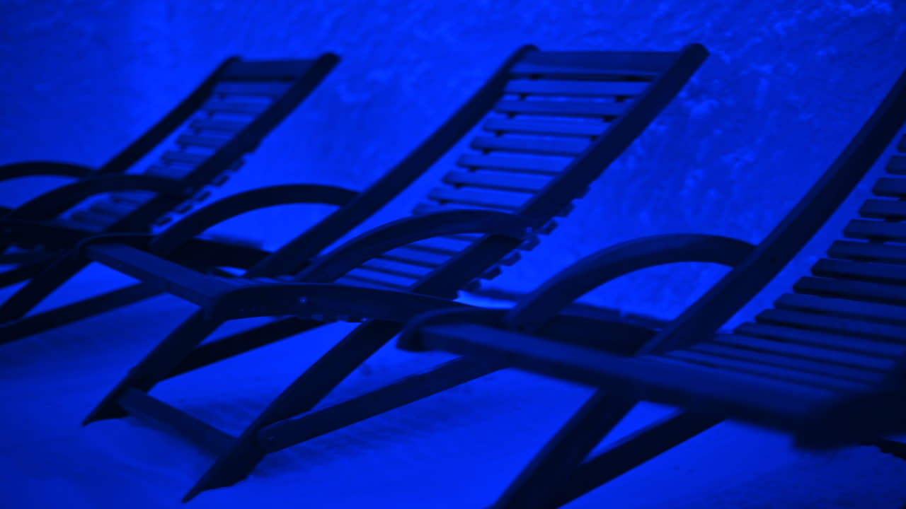 Resting chairs in a salt room with blue light