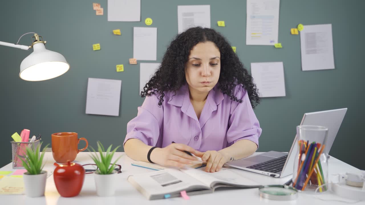 Female student bored with studying.