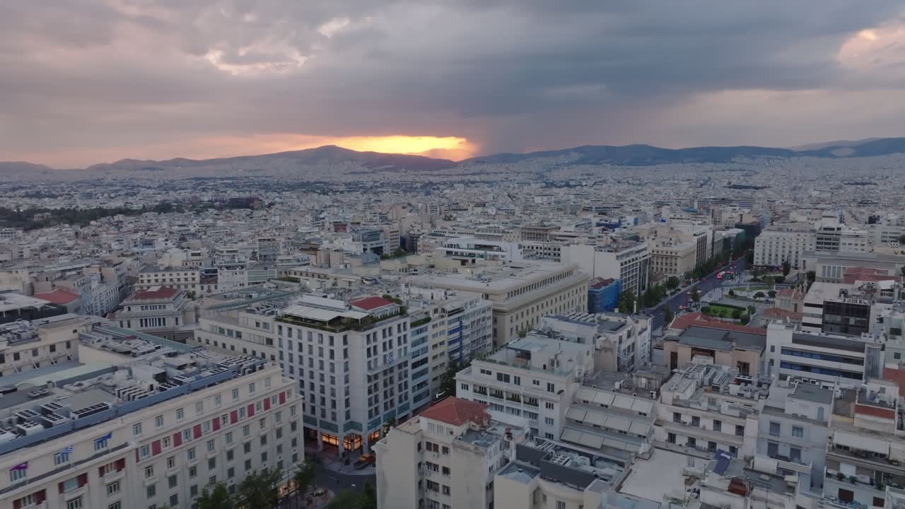 Reveal of cloudy sunset over Athens, Greece