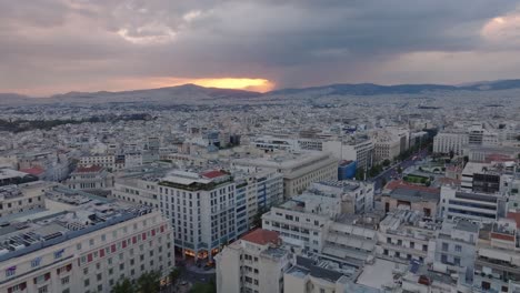 reveal of cloudy sunset over athens, greece