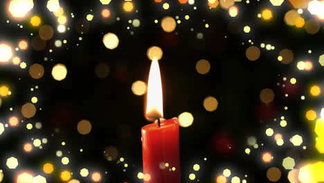 animación de la vela roja de navidad y las luces de hadas parpadeando sobre un fondo negro.