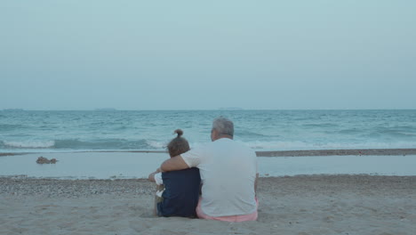 boy enjoys being in grandpa hugs