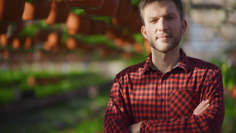 success gardener in lush greenhouse portrait