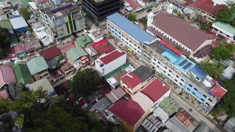 Taraw-cliff-and-El-Nido-port-beachfront-and-Bacuit-Bay,-Philippines,-aerial-dolly