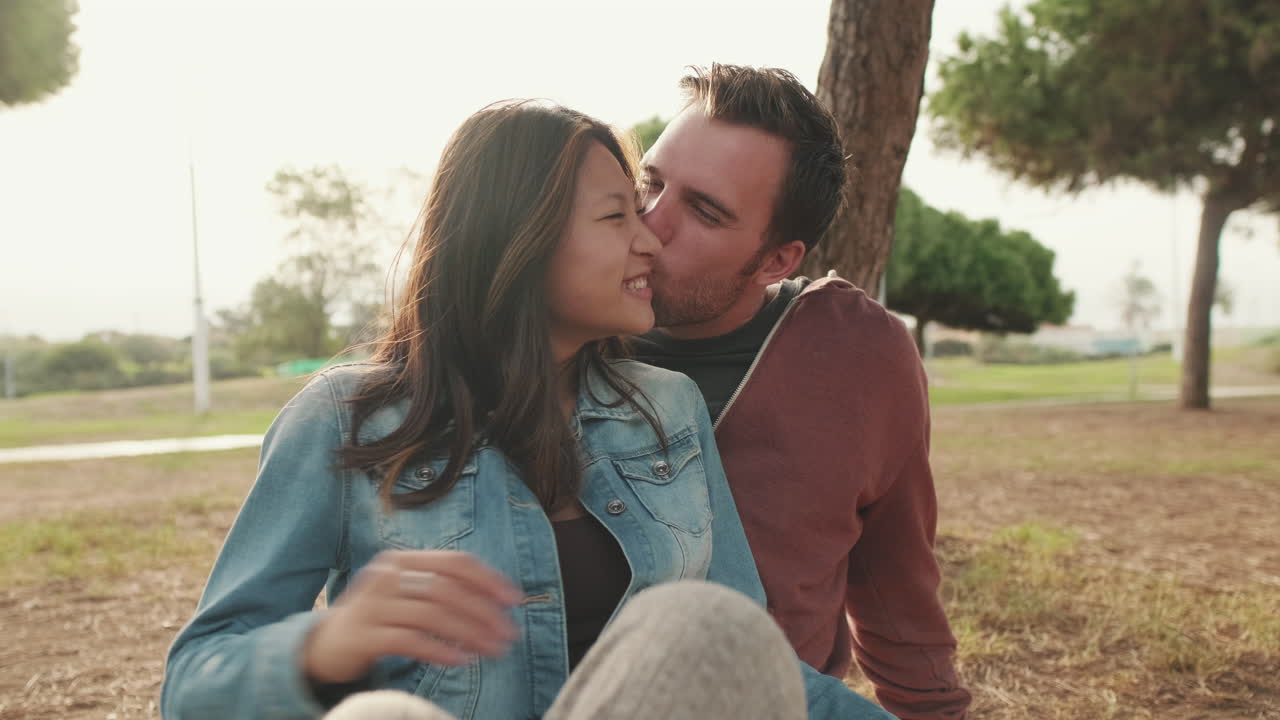 Couple sharing a romantic moment in the park