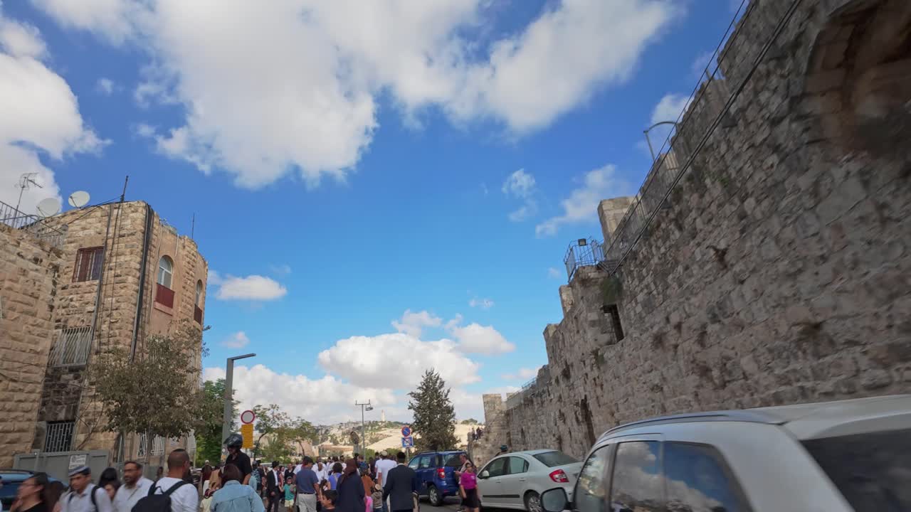 Hyperlapse journey on a busy road beside the Old City walls in Jerusalem's Jewish Quarter