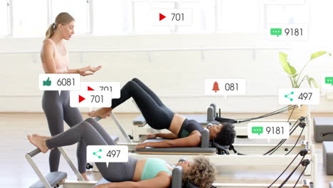 social media interaction icons animation over women exercising in fitness studio