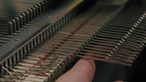 hand pulling the weaving machine