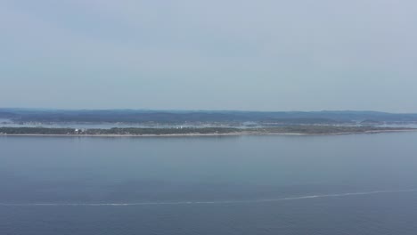 Aerial-of-the-Jomfruland-Lighthouse-It-is-a-coastal-lighthouse-located-on-the-island-of-Jomfruland-in-Kragerø,-Norway