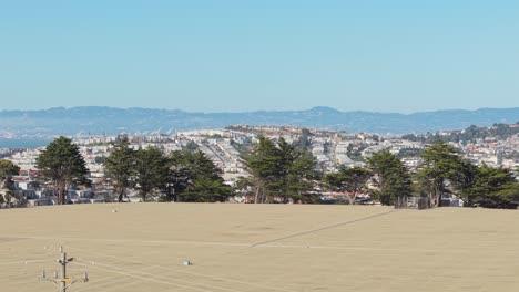slow right to left aerial shot of bernal heights in san francisco california.