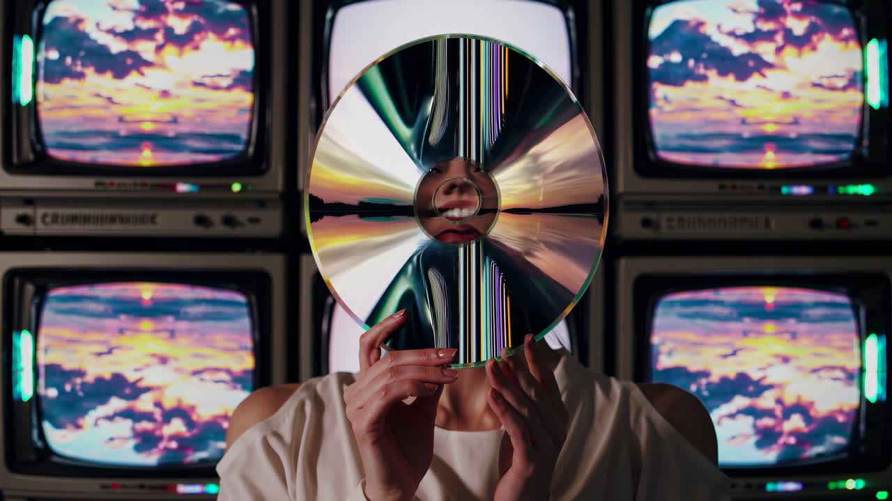 Woman Hiding Behind a CD in Front of Retro TVs
