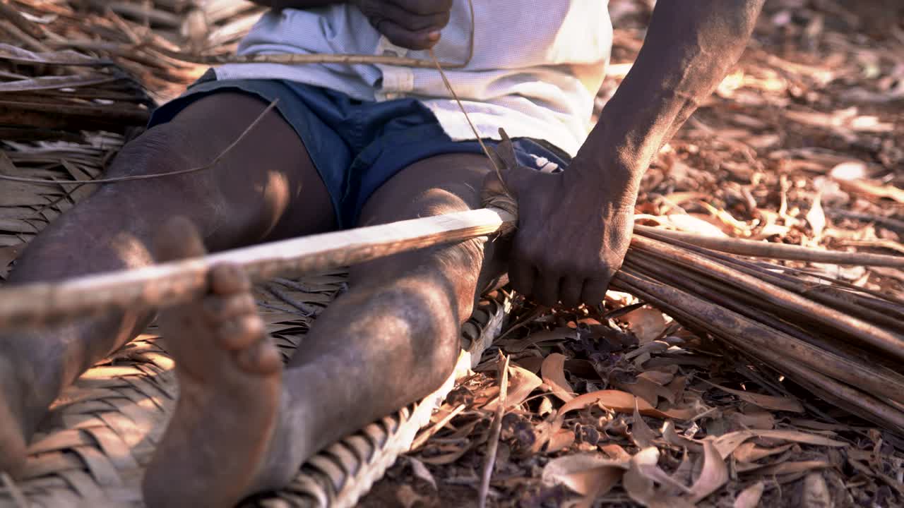 Native African of Comoros making Wandza Element for his Roof