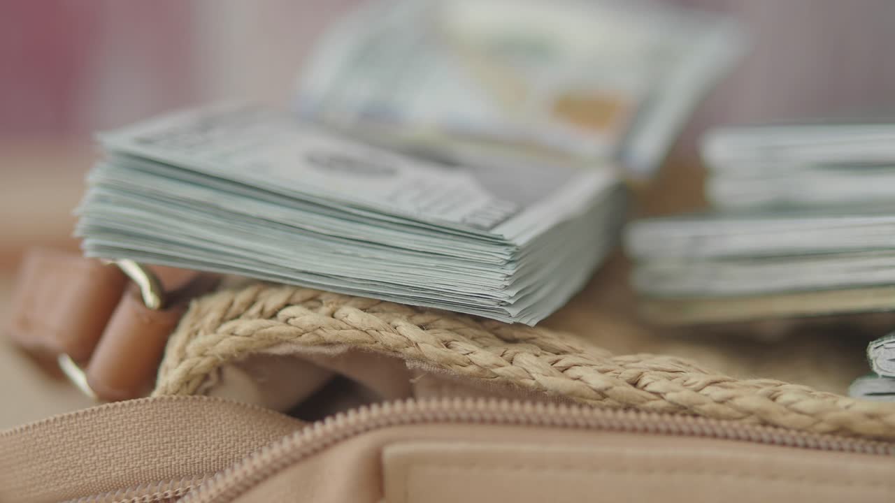 Stacks of Money and Notebooks