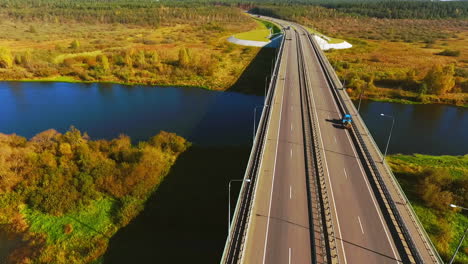 autumn road view from above. highway on autumn background. road river landscape