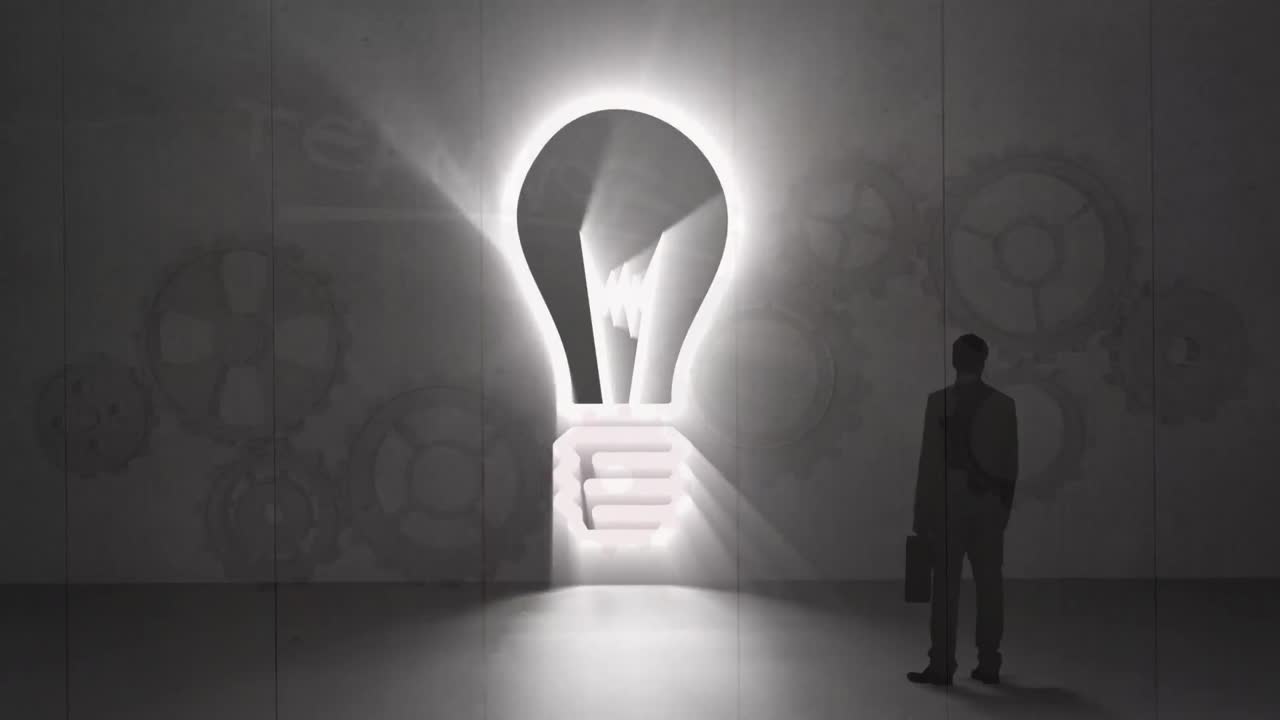 animación del bulbo y la silueta humana sobre fondo marrón con engranajes