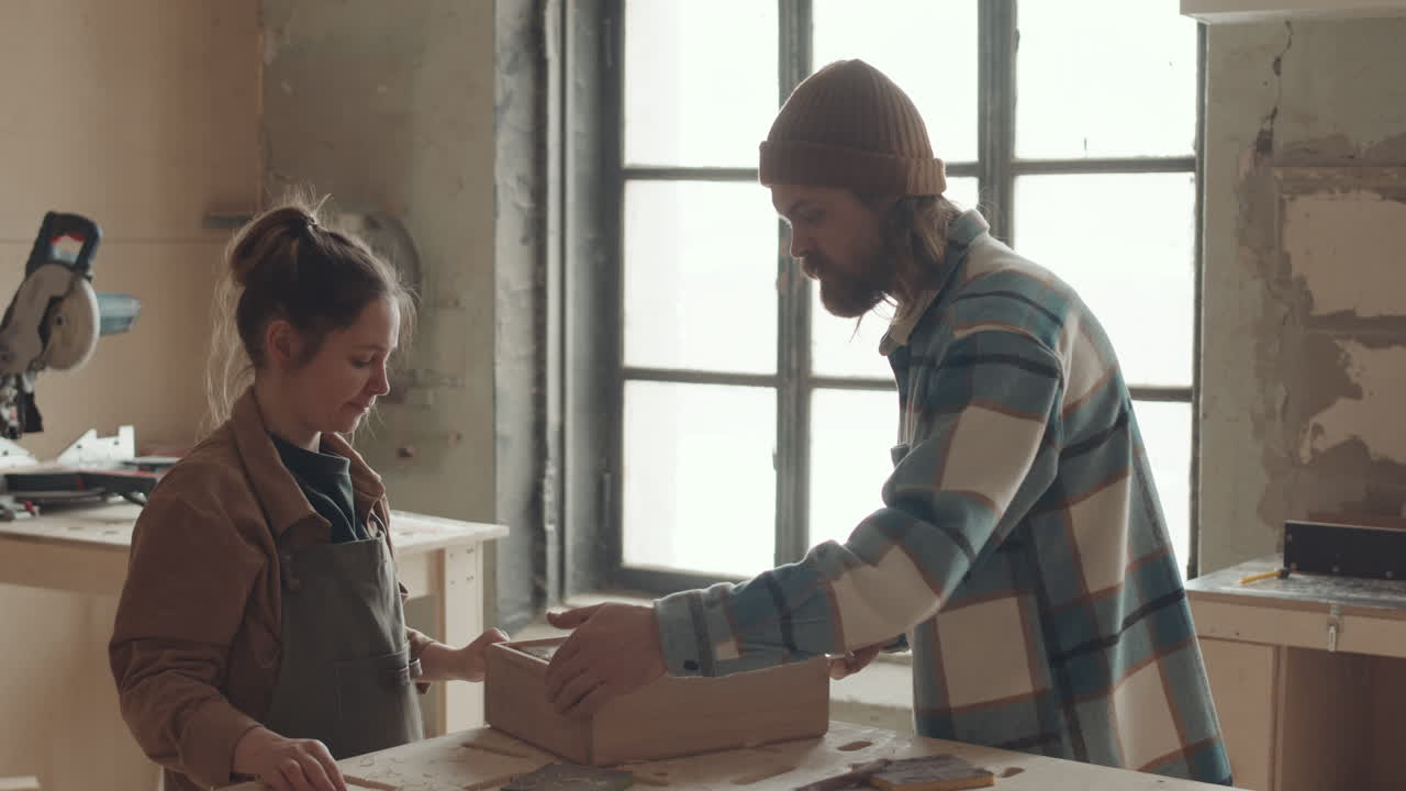 Pair of Carpenters Finishing Wooden Drawer