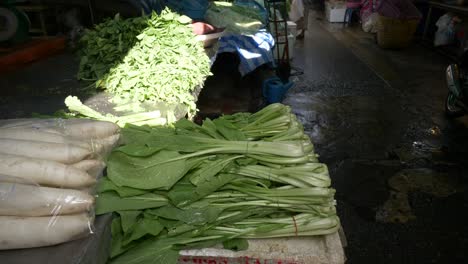 asian thailand local street food vegetable market greens on counter for sale