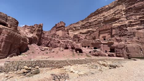 petra valley in wadi musa, jordan with the treasury in the middle of a rocky and mountainous landscape, an unesco heritage site, ancient nabatean kingdom 4k establish shot