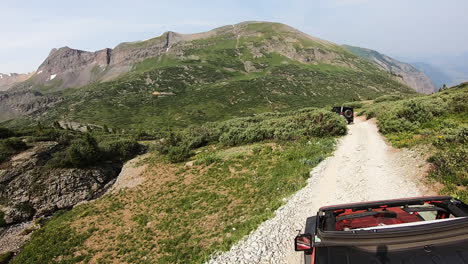 pov from rooftop of 4wd vehicle following another on black bear pass trail