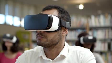 serious african american man experiencing new vr glasses