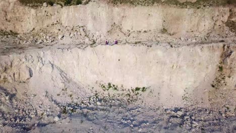 white stone mining on bank of piave river with blue water white stone mining on bank of piave river with clear blue water professional machinery mines minerals in italian alps aerial view