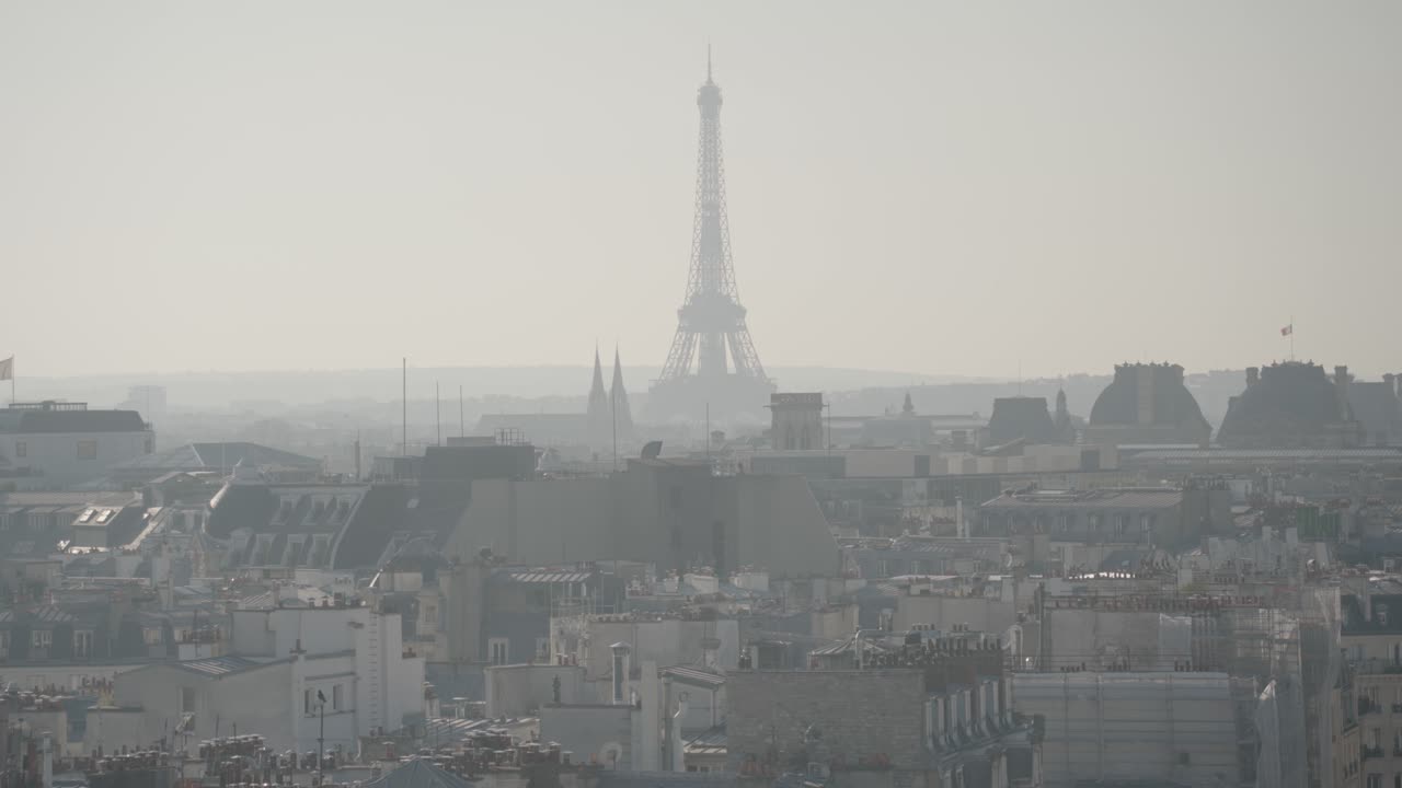 Paris cityscape with Eiffel Tower in fog