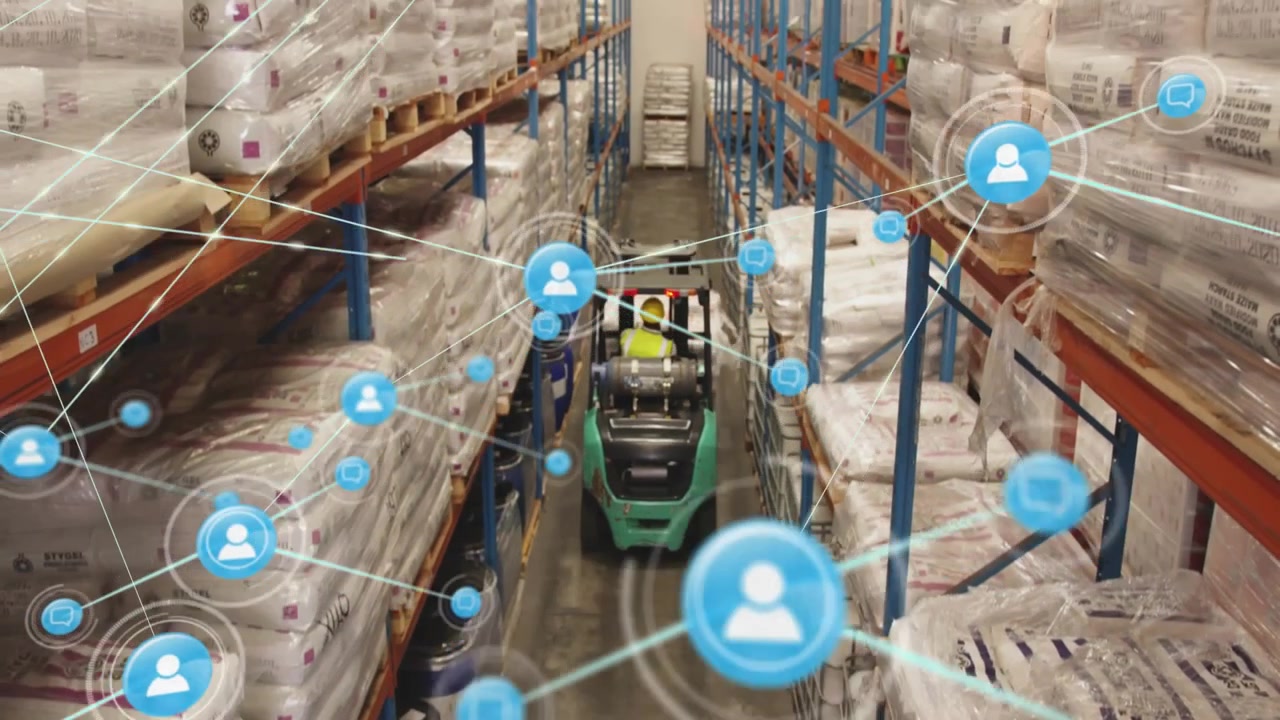network icon pulsing initiating warehouse forklift driving down aisle as connectivity icons growing