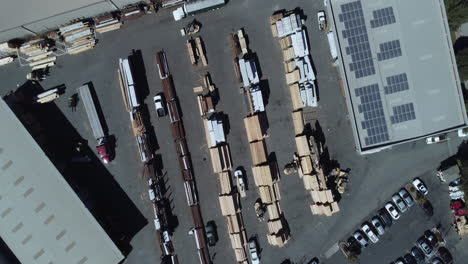 drone shot over a large industrial lumber yard