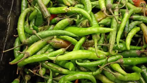 green chili peppers for sale in a local market