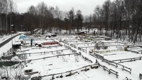 Community-Farming-Area-Covered-in-Snow,-Sweden,-Aerial