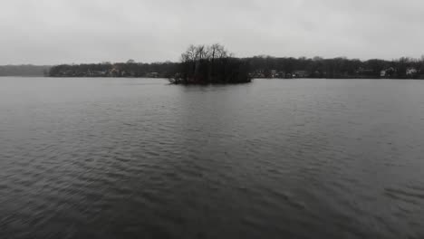 overcast day at the lake with island and houses