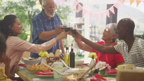 multi-generation african american family spending time in garden