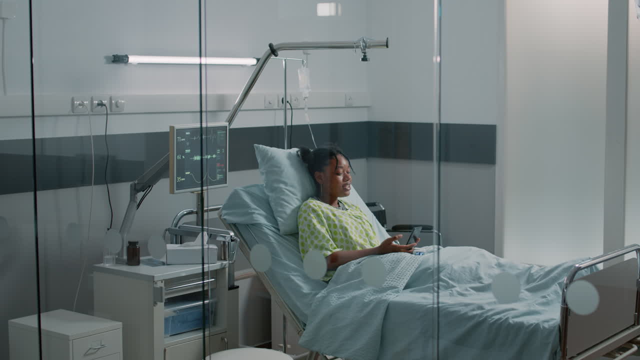 Young woman waving at video call on smartphone