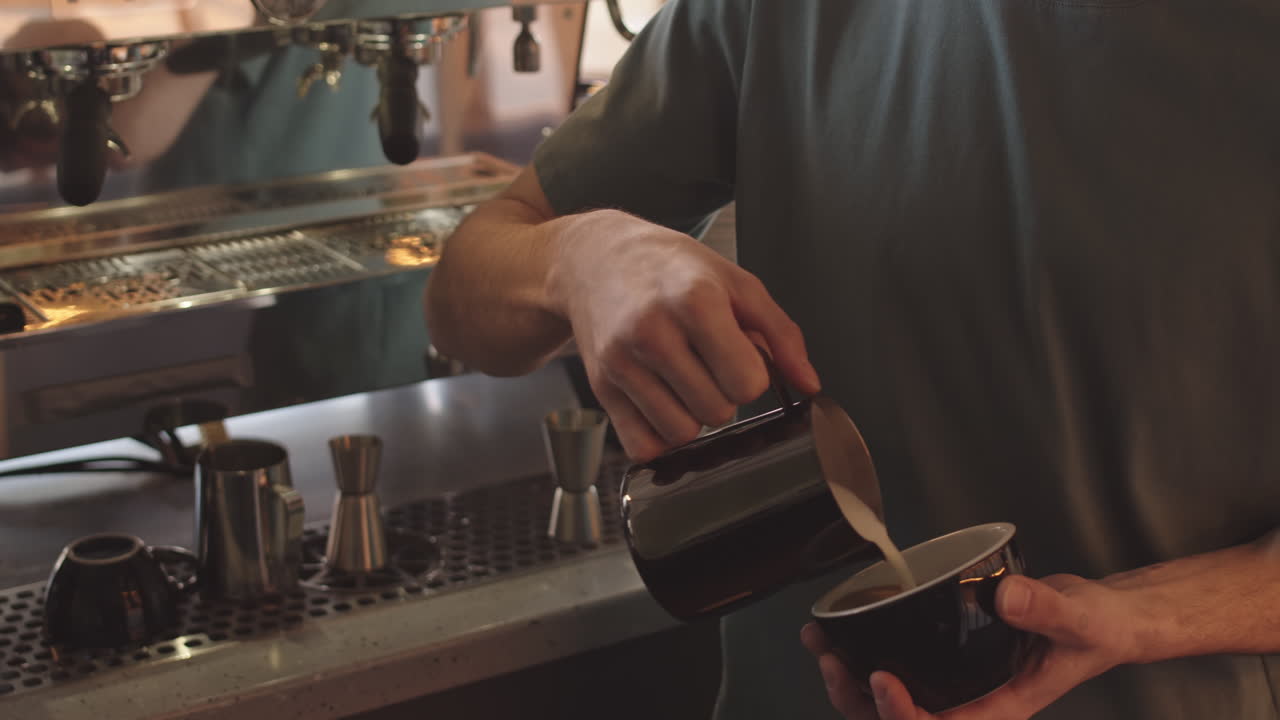 Professional Barista Making Cappuccino in Coffeeshop