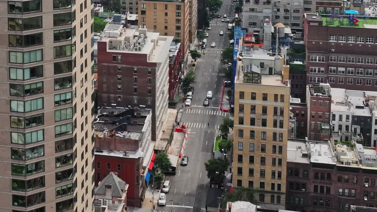 Drone view of bustling New York City street amidst tall buildings