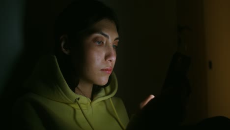 woman using a phone at night