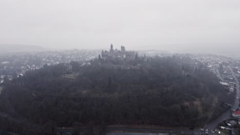 aerial footage of braunfels castle on a gloomy winter day