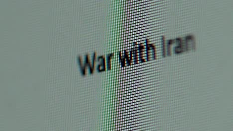 Words-War-with-Iran-being-typed-out-on-computer-screen-extreme-macro