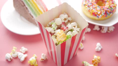 colorful treats: cake, popcorn, and donut