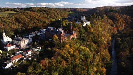 aerial view of red castle and white manor house in hradec nad moravici, czech republic