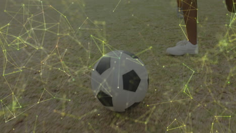 animation of networks over legs of diverse schoolgirls playing football in sports field