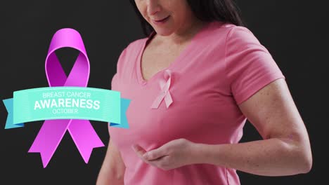 Breast-cancer-awareness-text-banner-against-mid-section-of-woman-wearing-pink-ribbon-on-her-chest