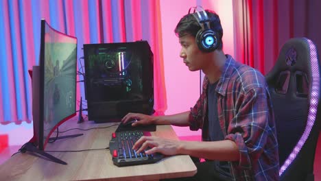 man gaming on computer