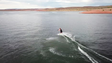 drone shot of wakeboard trick in lake powell utah