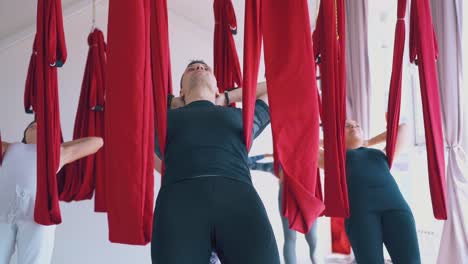 handsome-coach-and-pretty-women-group-relax-holding-hammocks