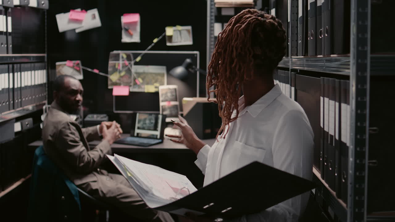 Detectives working in an investigation office