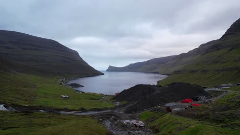 construction site with sand mounds by coastal town of arnafjordur in bordoy, faroe islands