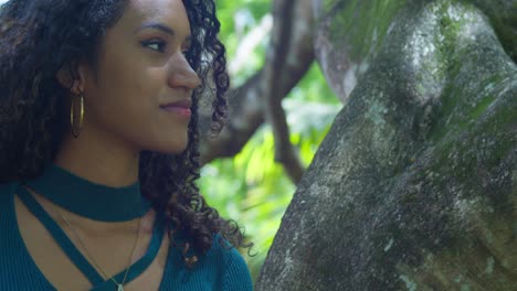 Close-up-facial-of-a-curly-hair-young-girl-on-a-tropical-island-with-blowing-her-hair